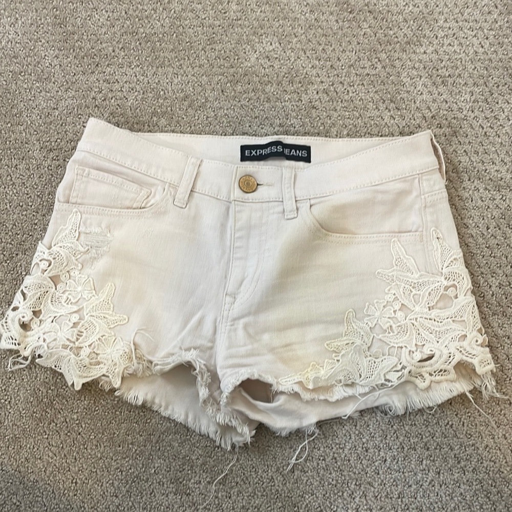 Express Ivory distressed lace side jean shorts